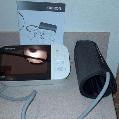 Omron Blood pressure monitor with instructions