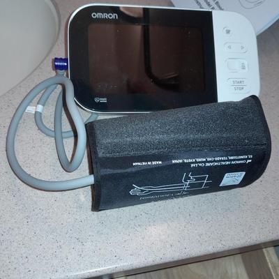 Omron Blood pressure monitor with instructions