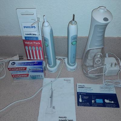 Rechargeable electric toothbrushes with heads and waterpik rinse aide