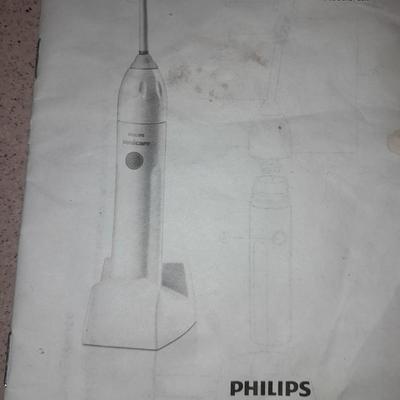 Rechargeable electric toothbrushes with heads and waterpik rinse aide