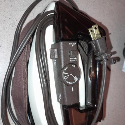 Travel bag / makeup bag full of traveling items for hygiene - Brook stone travel blow dryer