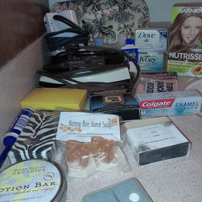 Travel bag / makeup bag full of traveling items for hygiene - Brook stone travel blow dryer