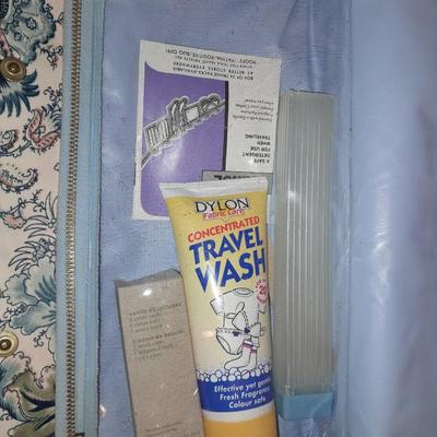 Travel bag / makeup bag full of traveling items for hygiene - Brook stone travel blow dryer