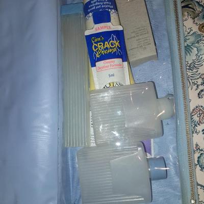 Travel bag / makeup bag full of traveling items for hygiene - Brook stone travel blow dryer