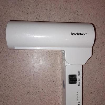 Travel bag / makeup bag full of traveling items for hygiene - Brook stone travel blow dryer