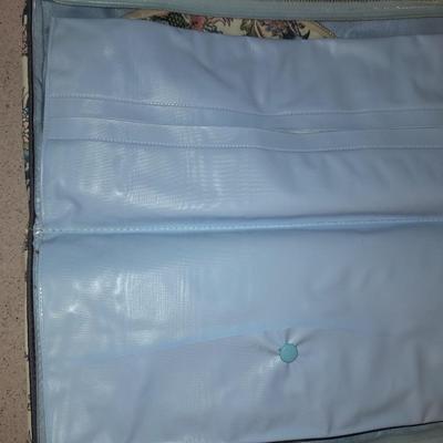 Travel bag / makeup bag full of traveling items for hygiene - Brook stone travel blow dryer
