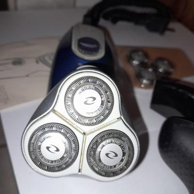 Two Phillips Norelco Electric Razors with charger