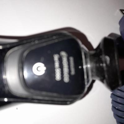 Two Phillips Norelco Electric Razors with charger