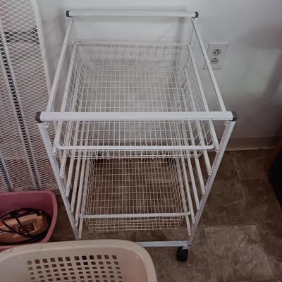 Metal Ironing board with metal baskets on stand and a clothing Iron