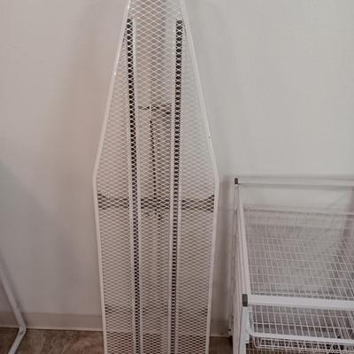 Metal Ironing board with metal baskets on stand and a clothing Iron