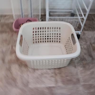 Metal Ironing board with metal baskets on stand and a clothing Iron