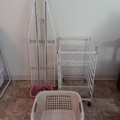 Metal Ironing board with metal baskets on stand and a clothing Iron