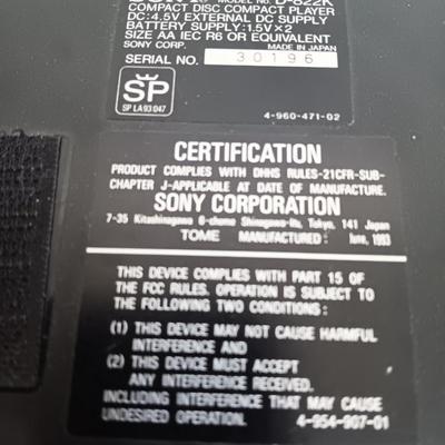 Portable Sony CD Car Discman with remote and vehicle attachments, a pair of Realistic speakers with case, and a Aiwa Walkman