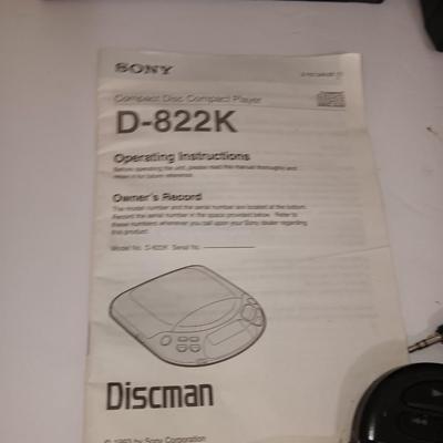 Portable Sony CD Car Discman with remote and vehicle attachments, a pair of Realistic speakers with case, and a Aiwa Walkman