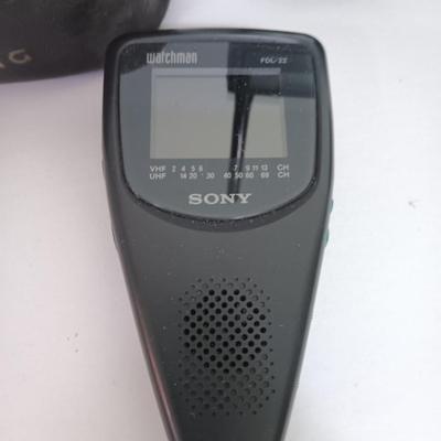 Working Uniden 10 channel Scanner radio with power cord with a Sony handheld watchman television