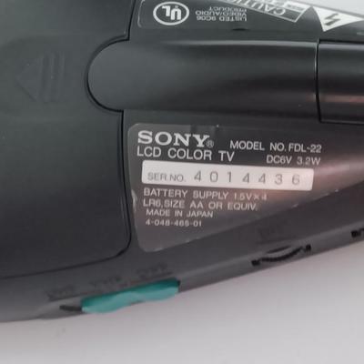 Working Uniden 10 channel Scanner radio with power cord with a Sony handheld watchman television