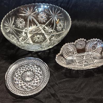 Three beautiful glass dishes Large bowl, oval scalloped dish, and small plate