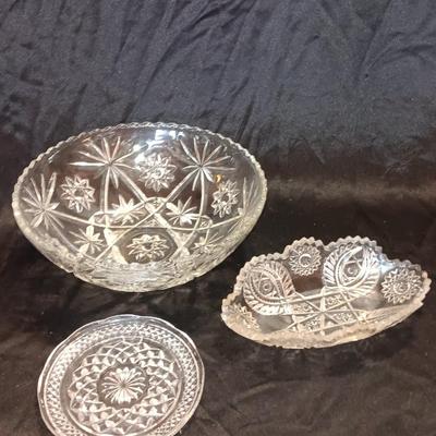 Three beautiful glass dishes Large bowl, oval scalloped dish, and small plate