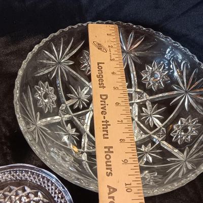 Three beautiful glass dishes Large bowl, oval scalloped dish, and small plate