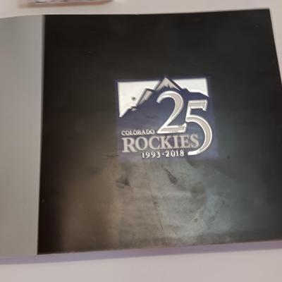 Colorado Rockies 25th anniversary book, Field played ball, and world series tickets