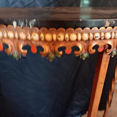Ornate iron demilune console table with brown rock like top