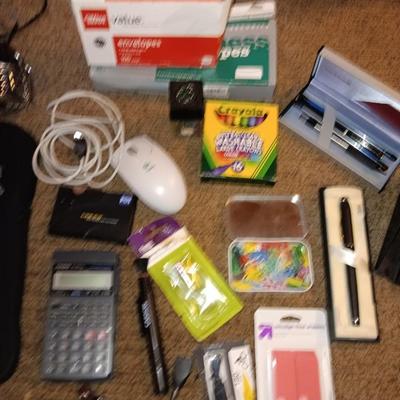 Assortment of office and school supplies including v tec cordless phones, personal fan and more