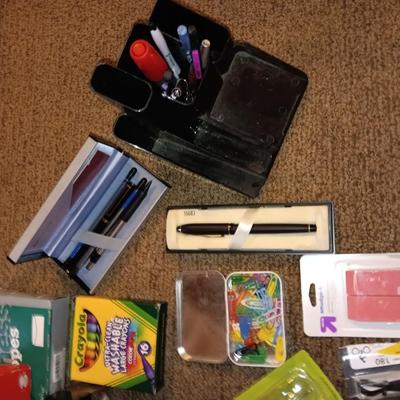 Assortment of office and school supplies including v tec cordless phones, personal fan and more