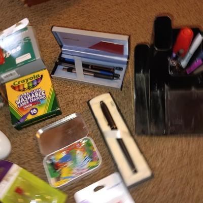 Assortment of office and school supplies including v tec cordless phones, personal fan and more