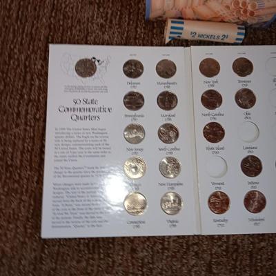 Preformed coin wrappers and a collection of United States quarters with map