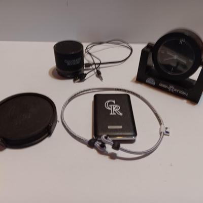 Colorado Rockies marked electronic gadgets - speaker - charger - clock - with coasters and a glasses neck band.