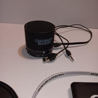 Colorado Rockies marked electronic gadgets - speaker - charger - clock - with coasters and a glasses neck band.