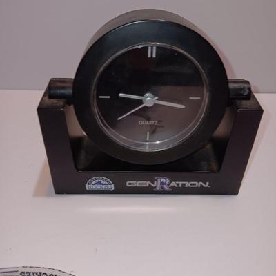Colorado Rockies marked electronic gadgets - speaker - charger - clock - with coasters and a glasses neck band.