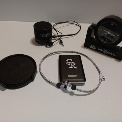 Colorado Rockies marked electronic gadgets - speaker - charger - clock - with coasters and a glasses neck band.