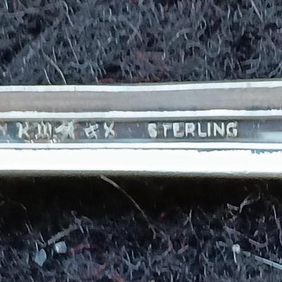 Sterling silver marked clam shaped spoon