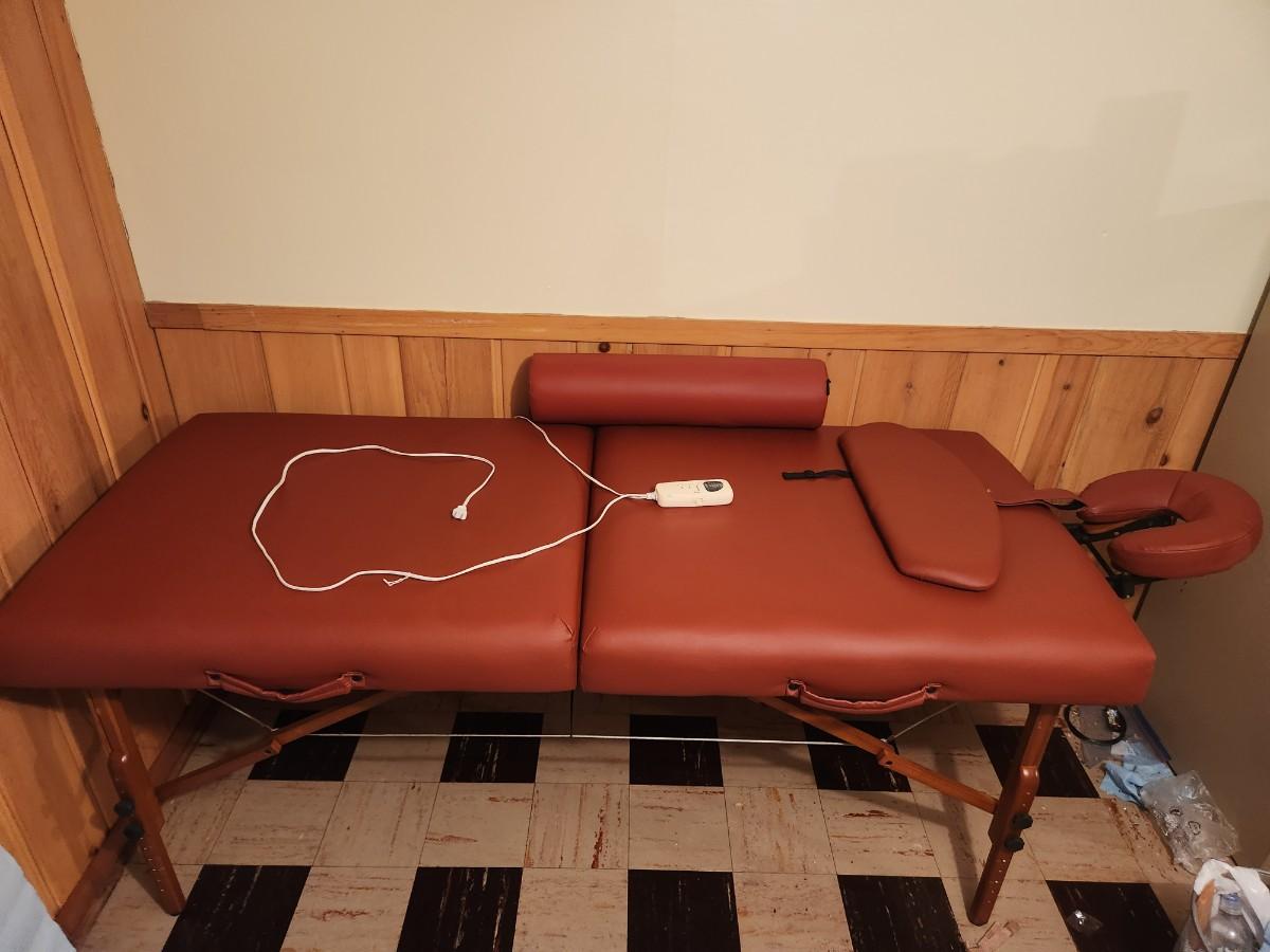 Heated massage table