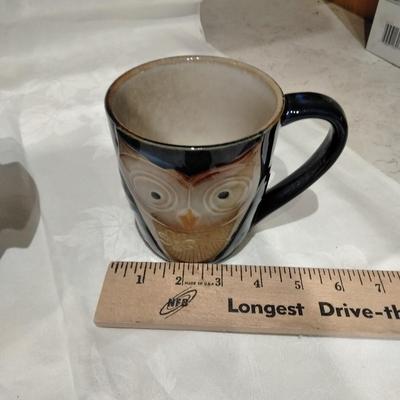 Kitchen pottery pieces, lidded pot, pie plate, and mugs