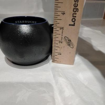 Three Starbucks mugs
