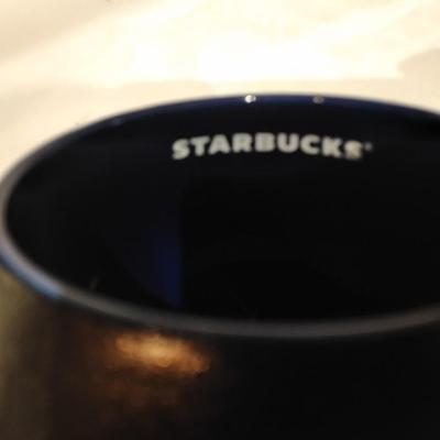 Three Starbucks mugs