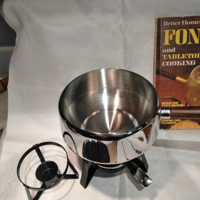Fondue set pot, burner, and servers with Fondue and tabletop cooking cookbook.