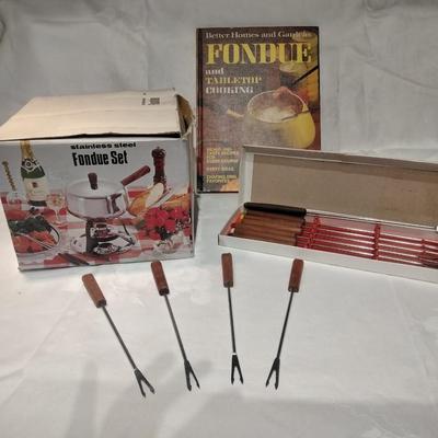 Fondue set pot, burner, and servers with Fondue and tabletop cooking cookbook.