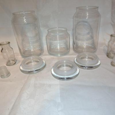 Collection of glass canisters and spice / pharmacy jars with lids
