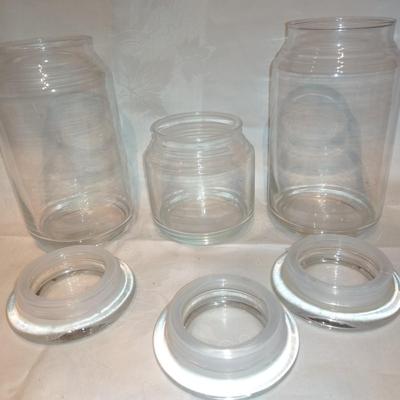 Collection of glass canisters and spice / pharmacy jars with lids