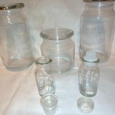 Collection of glass canisters and spice / pharmacy jars with lids