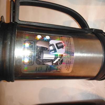 Stanley travel mug and two metal water bottles