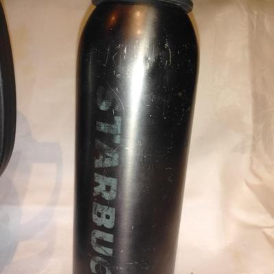 Stanley travel mug and two metal water bottles