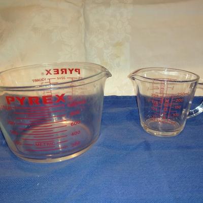 Two glass Pyrex measuring cups
