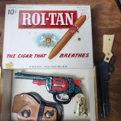 Cap guns and cigar box