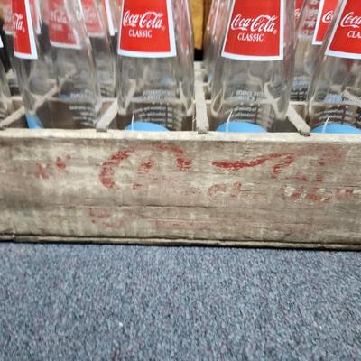 Coke bottles and box