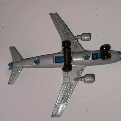 Three vintage metal airplanes and one British airlines model