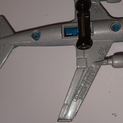 Three vintage metal airplanes and one British airlines model